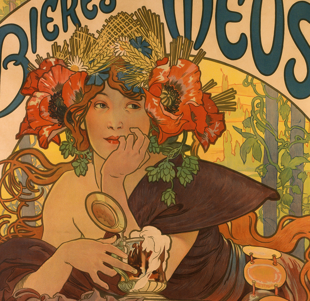 A cropped poster of a person wearing a big red floral headpiece and holding a cup with white foam.