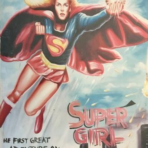 A cropped movie poster of a super heroine with a red and blue uniform flying over a city skyline.