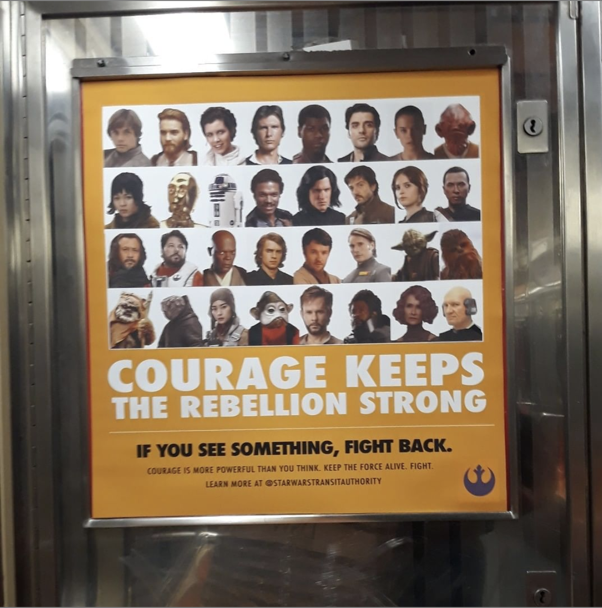 poster inside an MTA subway cart featuring the cast from the Star Wars films titled 