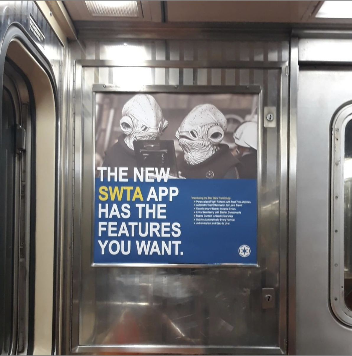 poster inside of an MTA subway cart of creatures from the Star Wars films