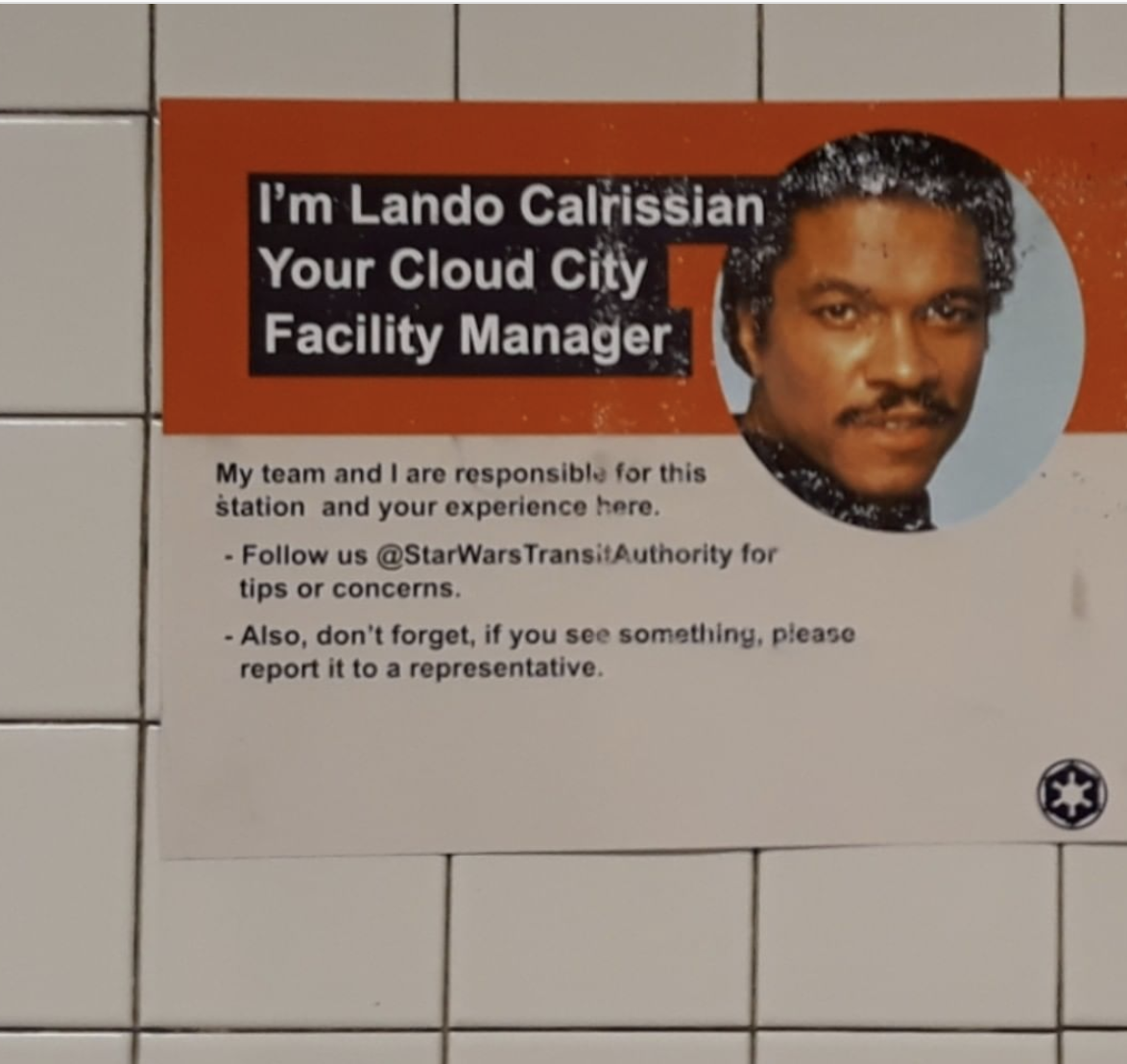 poster inside of an MTA subway station with an image of a black man titled 
