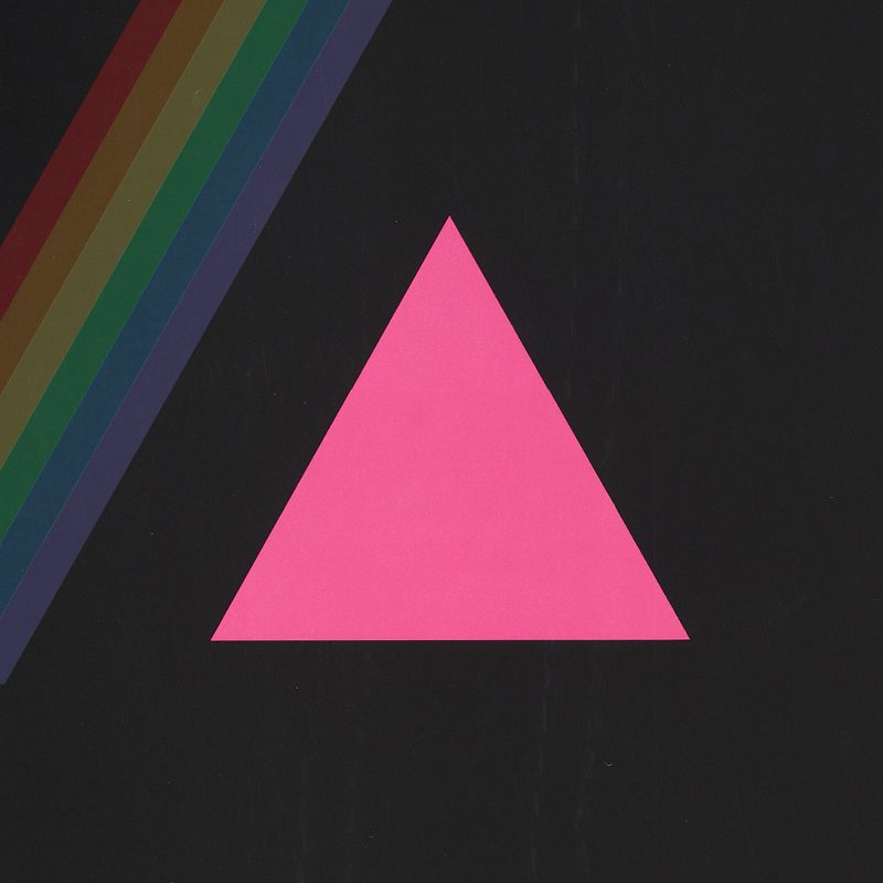 A poster featuring a pink triangle with a rainbow on the left corner on a black background.