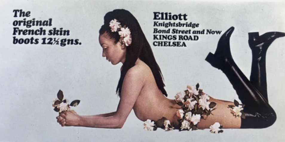 photograph of naked woman covered in flowers wearing black boots