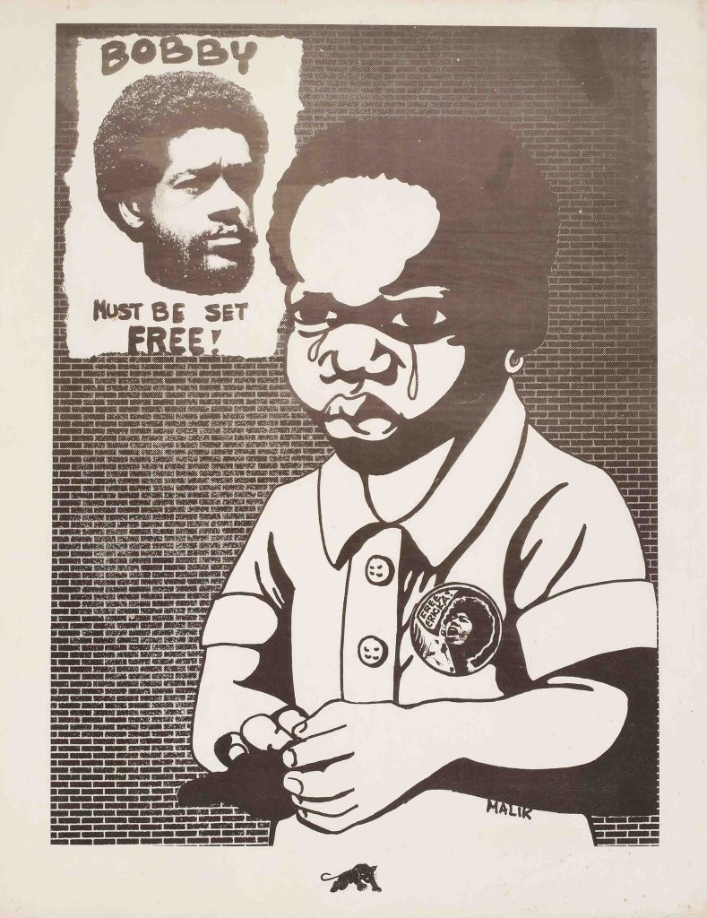 An offset poster of a young black child crying against a brick wall, a poster of an incarcerated man hanging in the background.