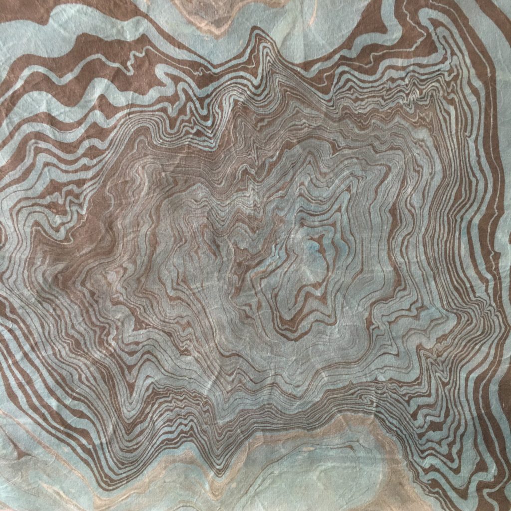 Gray and purple marbled paper.