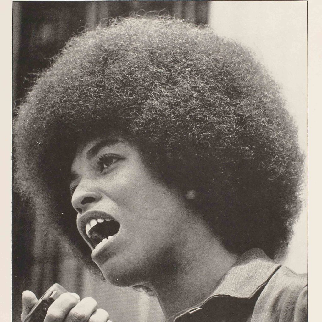 A scan of a paper flyer with an image of Angela Davis.