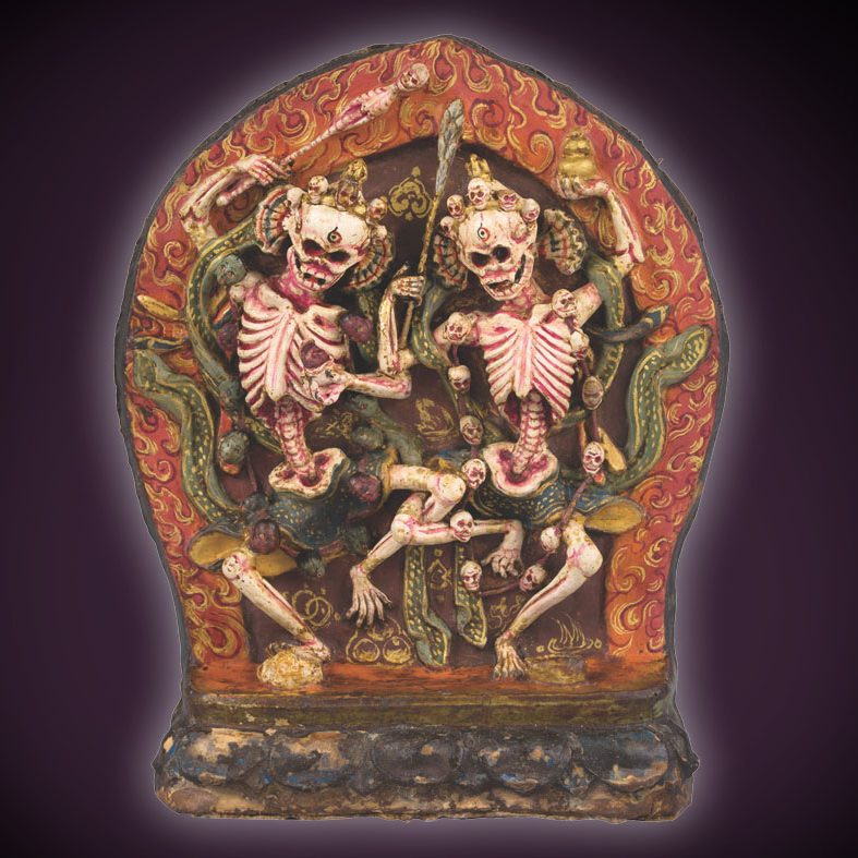 A shrine of two skeletons dancing together in front of a purple background