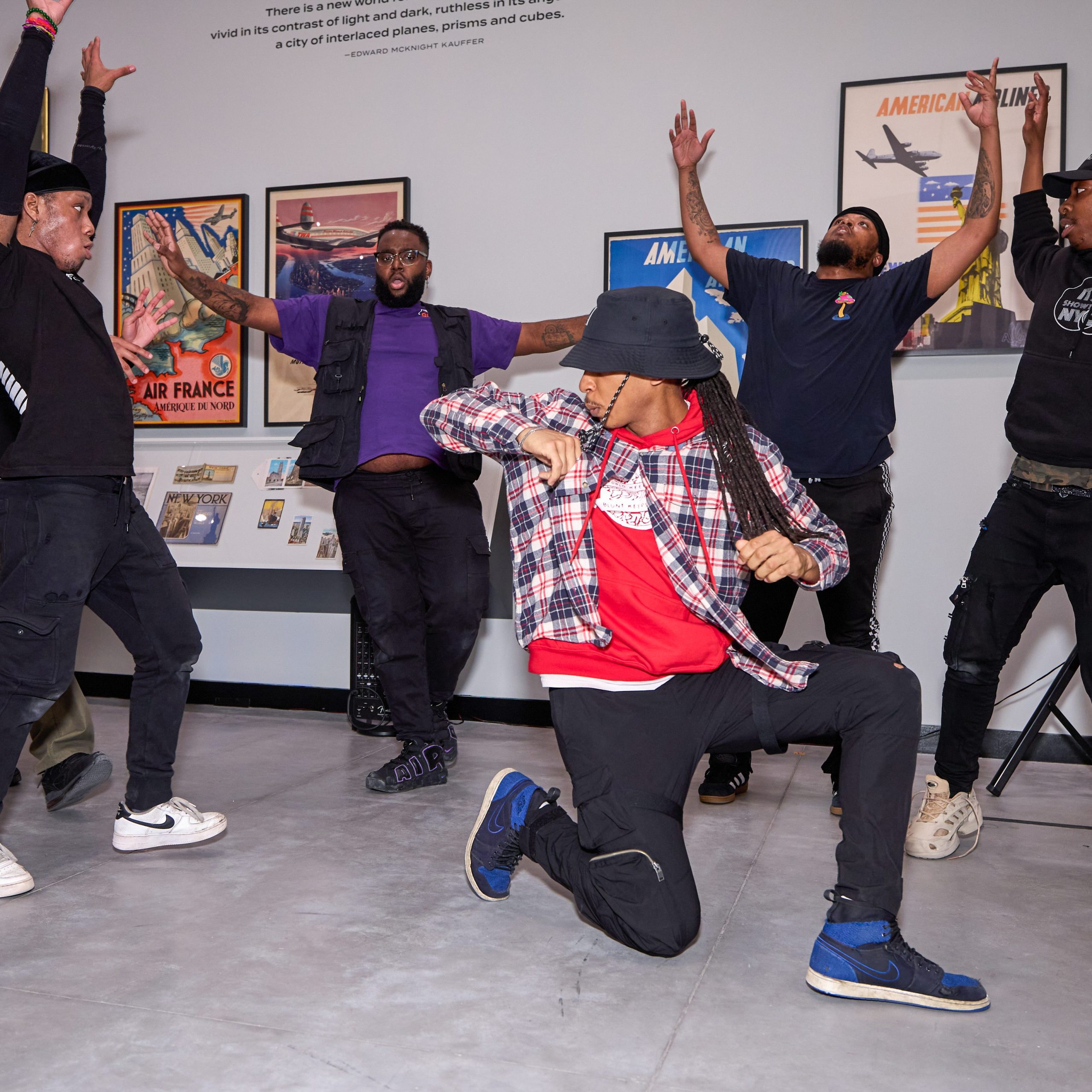 A photograph of Its Showtime NYC dancers in the Poster House Main Gallery.