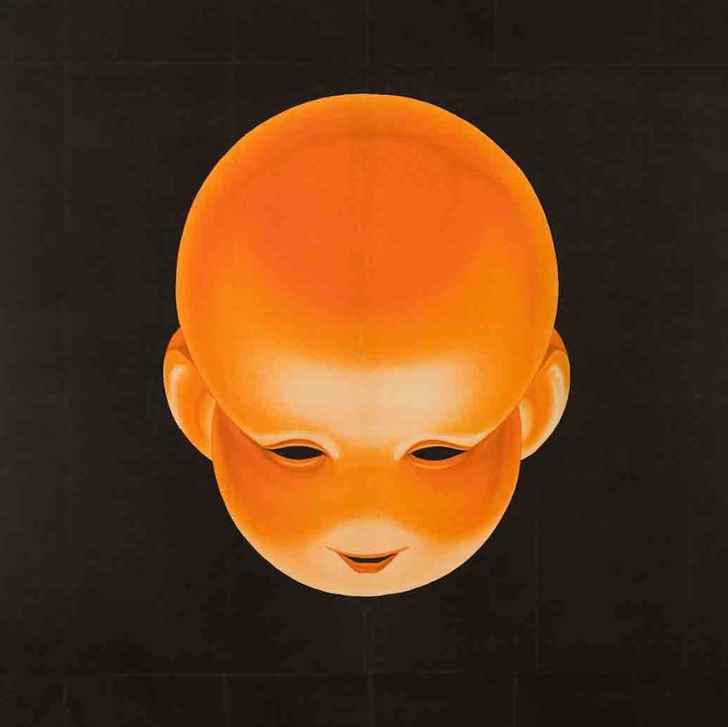 A poster image of baby head on a field of black with green ribbon lettering