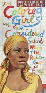Poster of a woman in a yellow outfit in front of a tiled wall with colorful paint text on it.