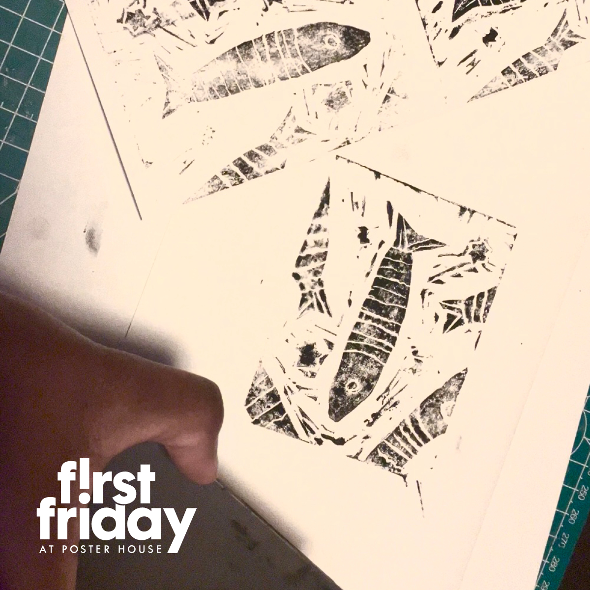 a person making linocut prints of a fish