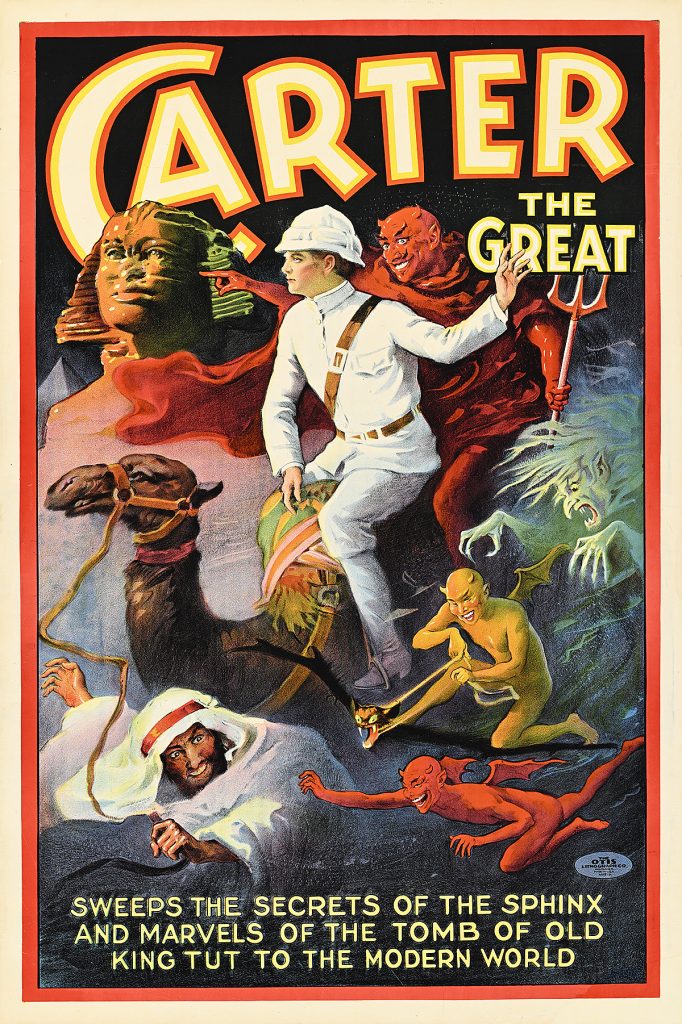 Poster of a man riding a camel surrounded by mysterious Egyptian beings.