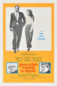 An orange poster for the film Guess Who's Coming to Dinner with black-and-white photographs on it. The largest photograph is of a couple—the man is Black and the woman is white. There are two small portraits at the bottom of the poster: one is of an older white man and the other is of an older white woman.