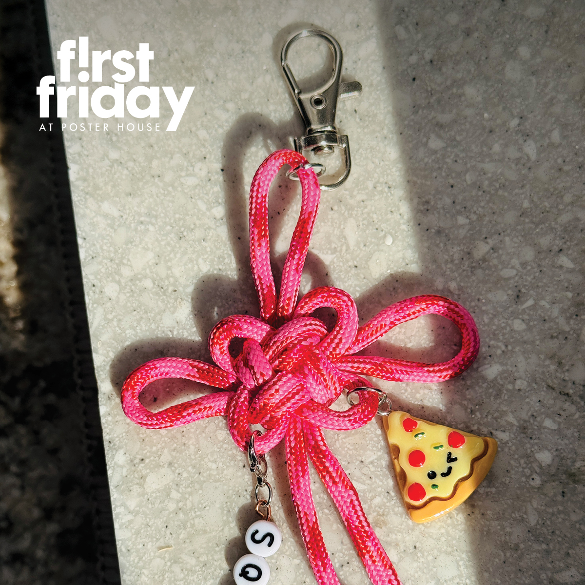 A pink keychain made out of knotted rope and various charms.