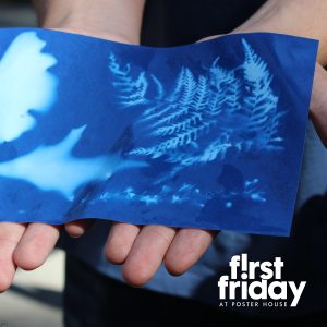 Hands holding a cyanotype print.