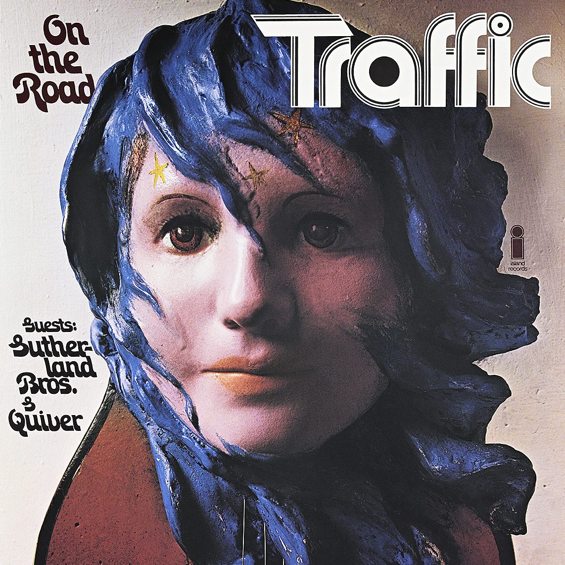 A poster of a guitar with a blue-haired woman's head coming out of it.