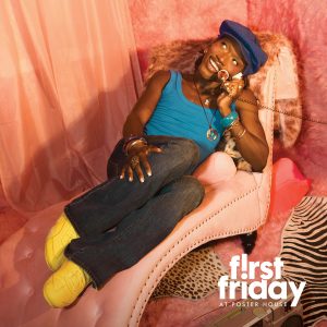 A person lying on a pink and talking on the phone.